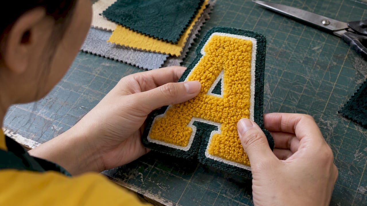 Close view of raised chenille patch texture