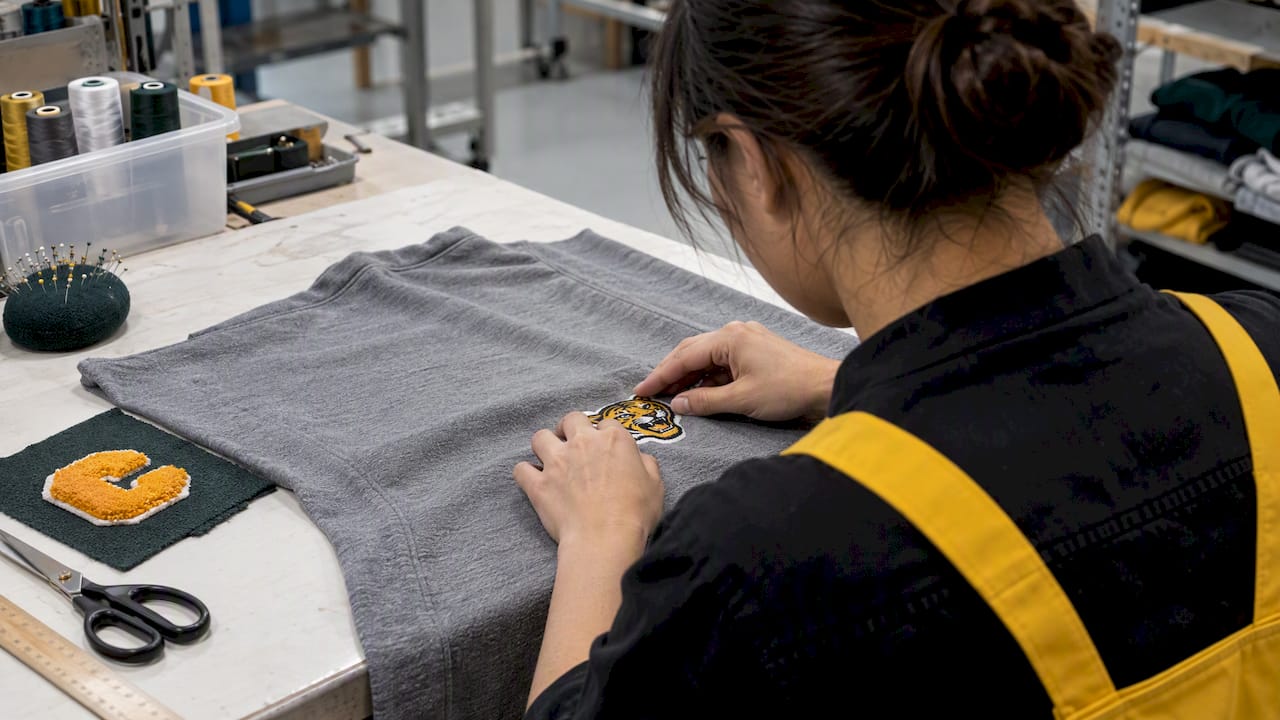 Technician testing patch on garment fabric